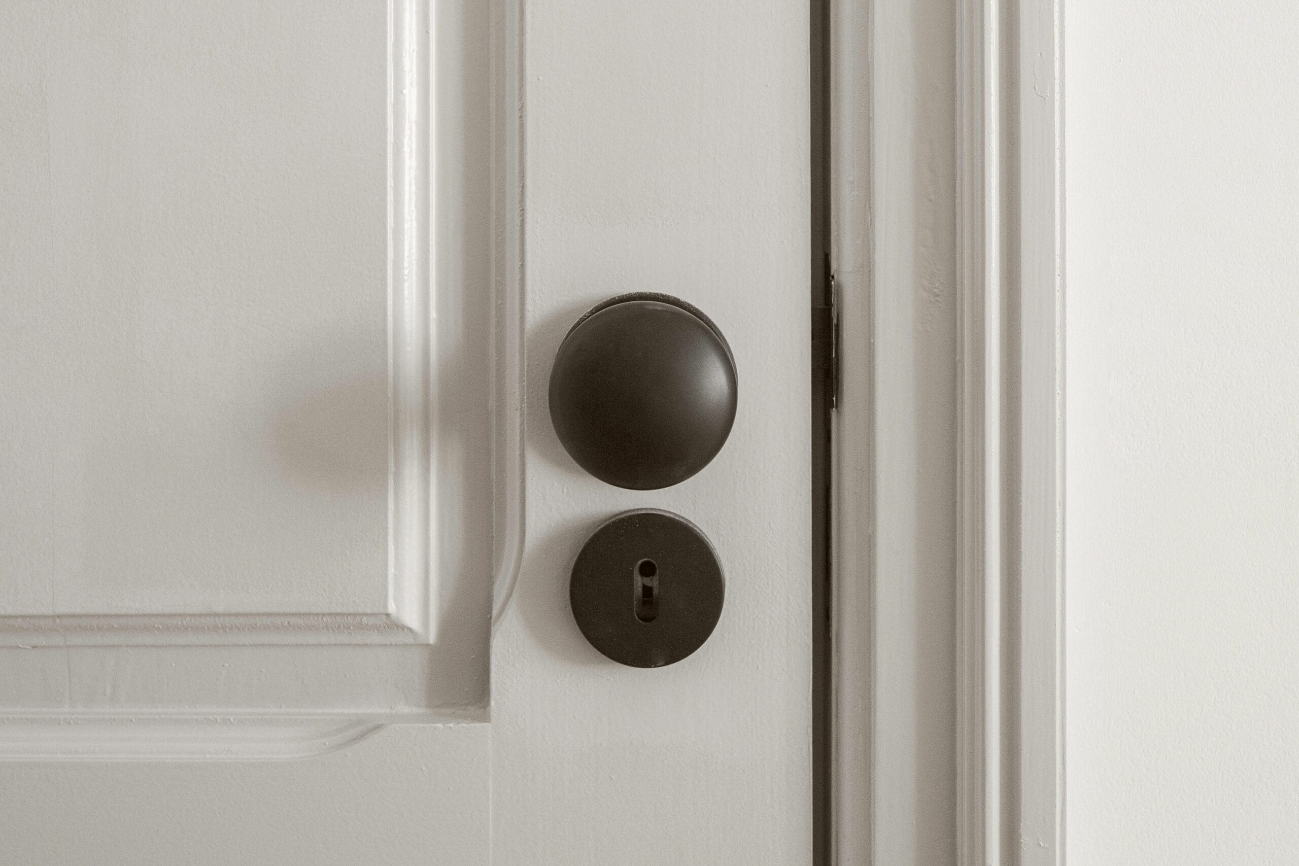 A White Door With Black Handle