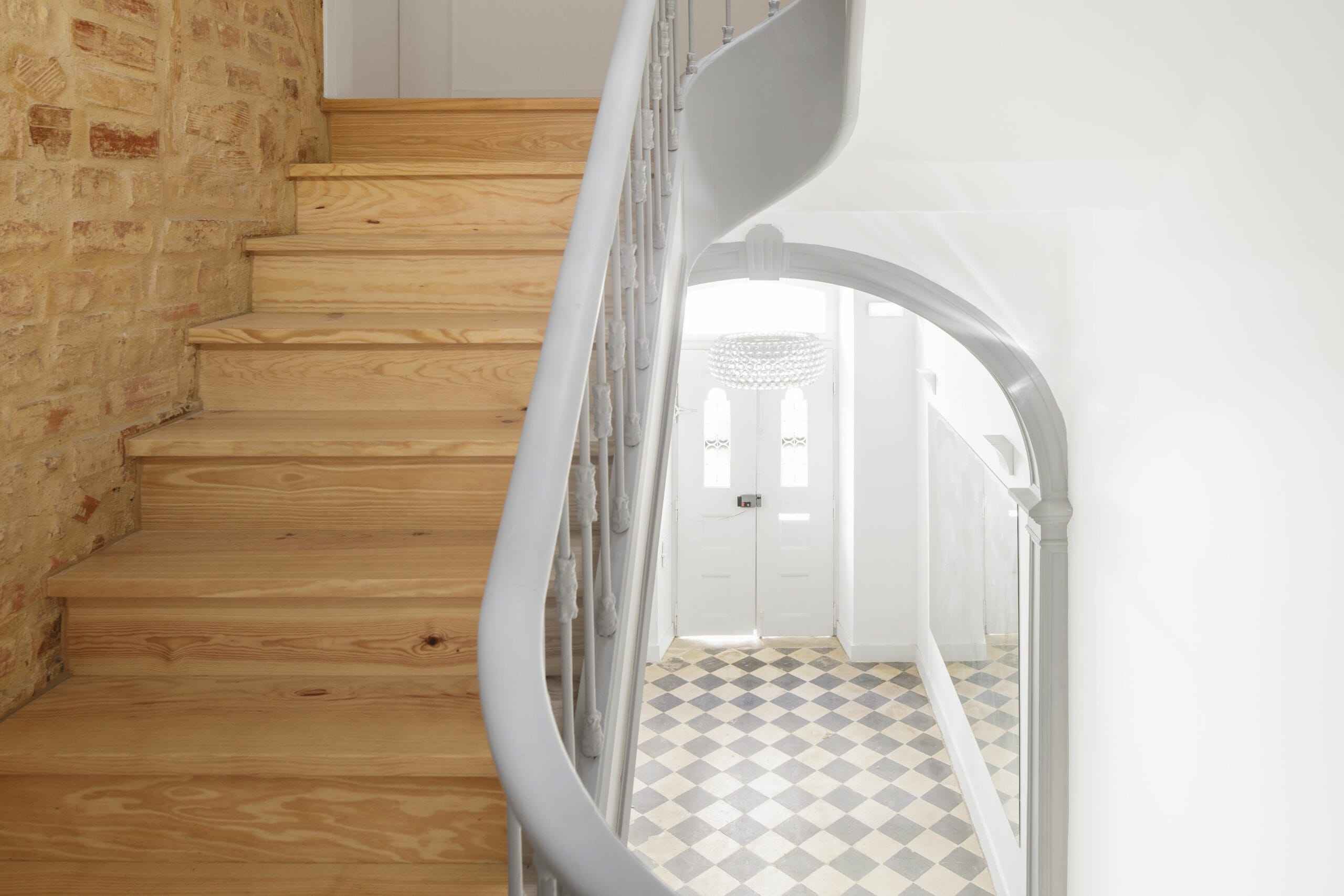 White Hallway And Wooden Stairs